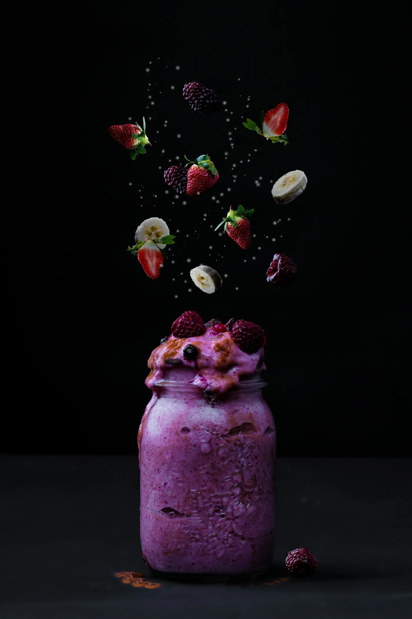 Purple berry smoothie with strawberries, banana and blackberries